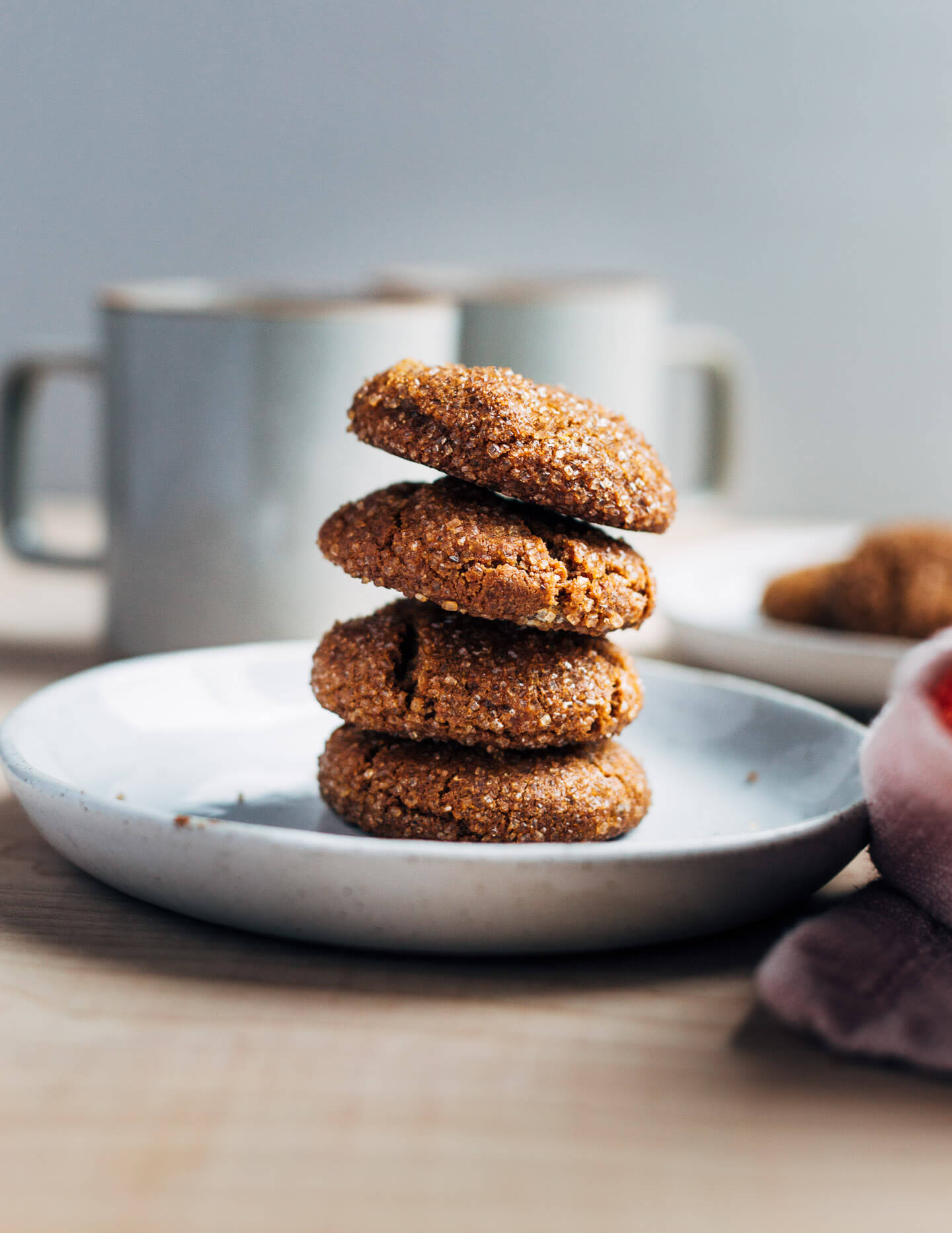 A stack of cookies on a plate.