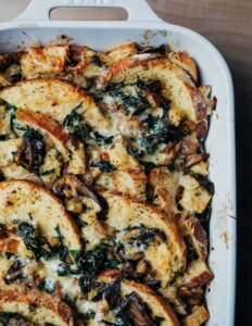 Looking down on a casserole dish with cheesy bread pudding