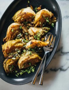 A platter of braised cabbage wedges.