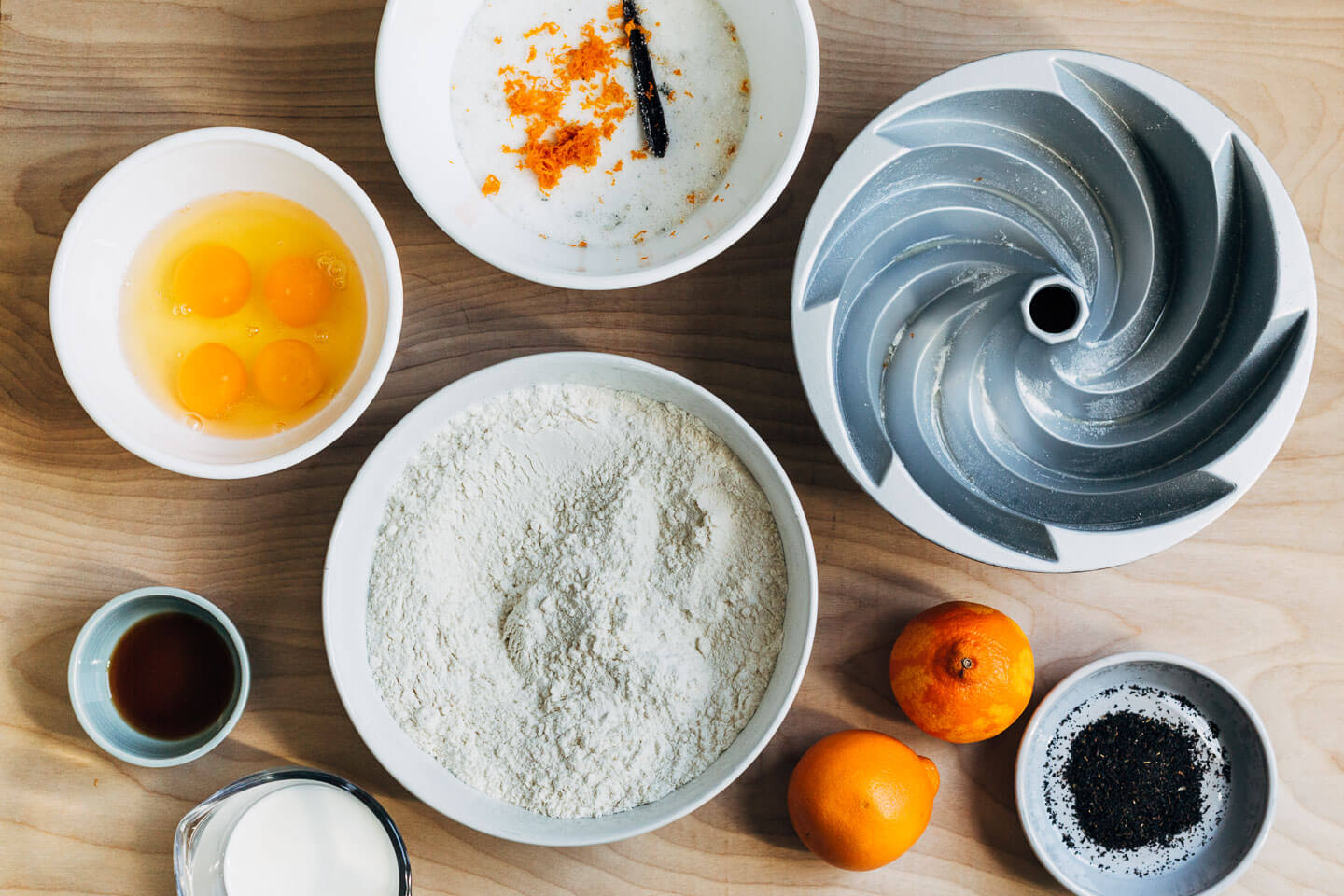 Looking down on the ingredients for an Earl Grey bundt cake laid out on a table.