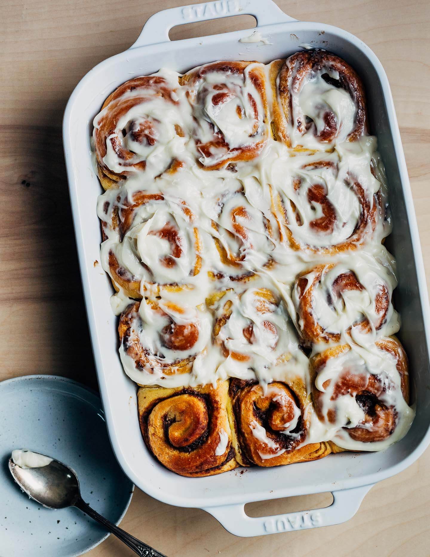 A baking dish with just-baked pumpkin cinnamon rolls. 