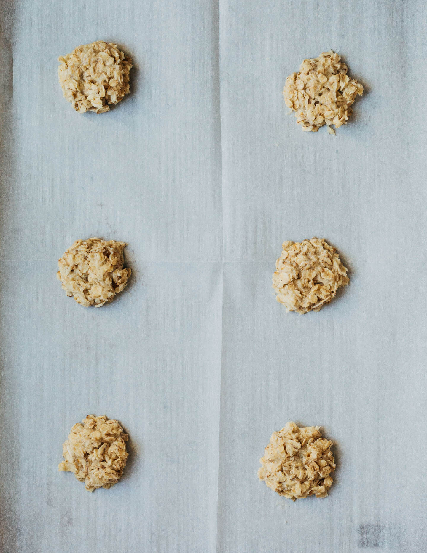 Little mounds of cookie batter on a baking sheet. 