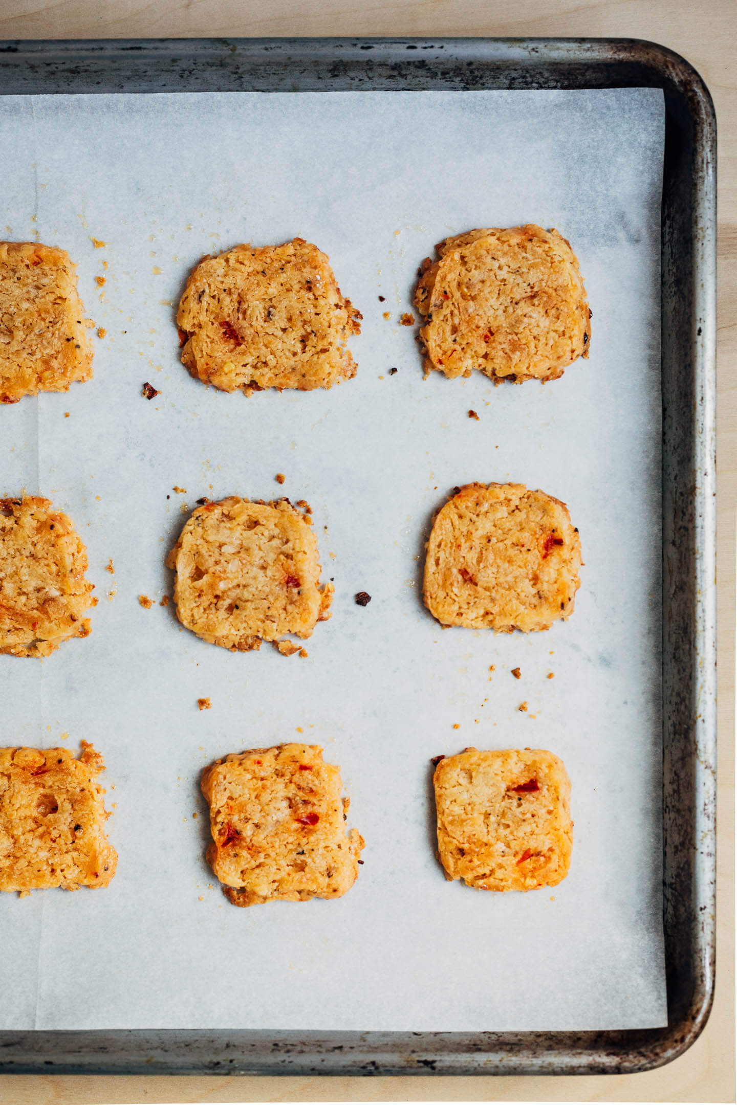 Baked cheddar crackers on a baking sheet. 