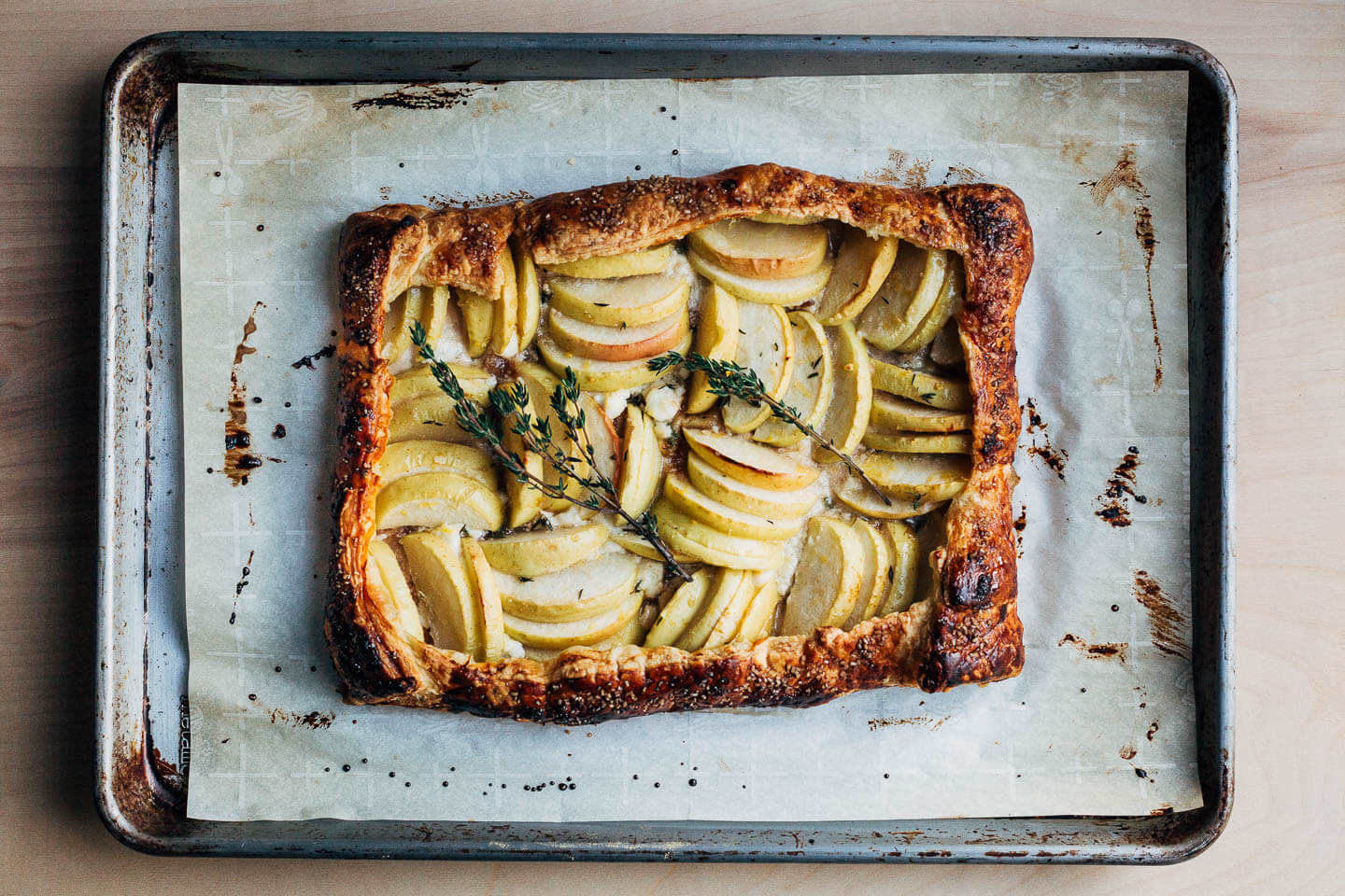A chèvre and apple tart, just baked, still on the baking sheet. 