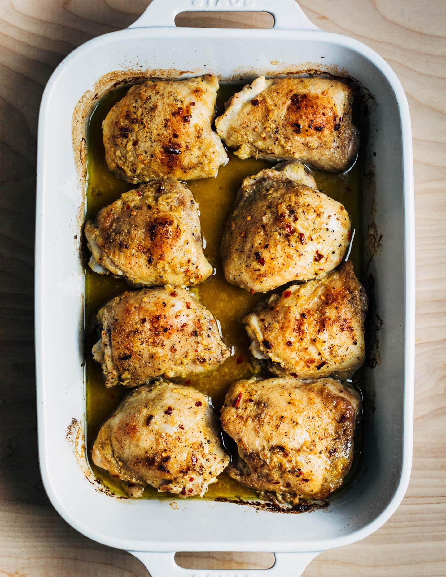 Baking chicken thighs in a baking dish. 
