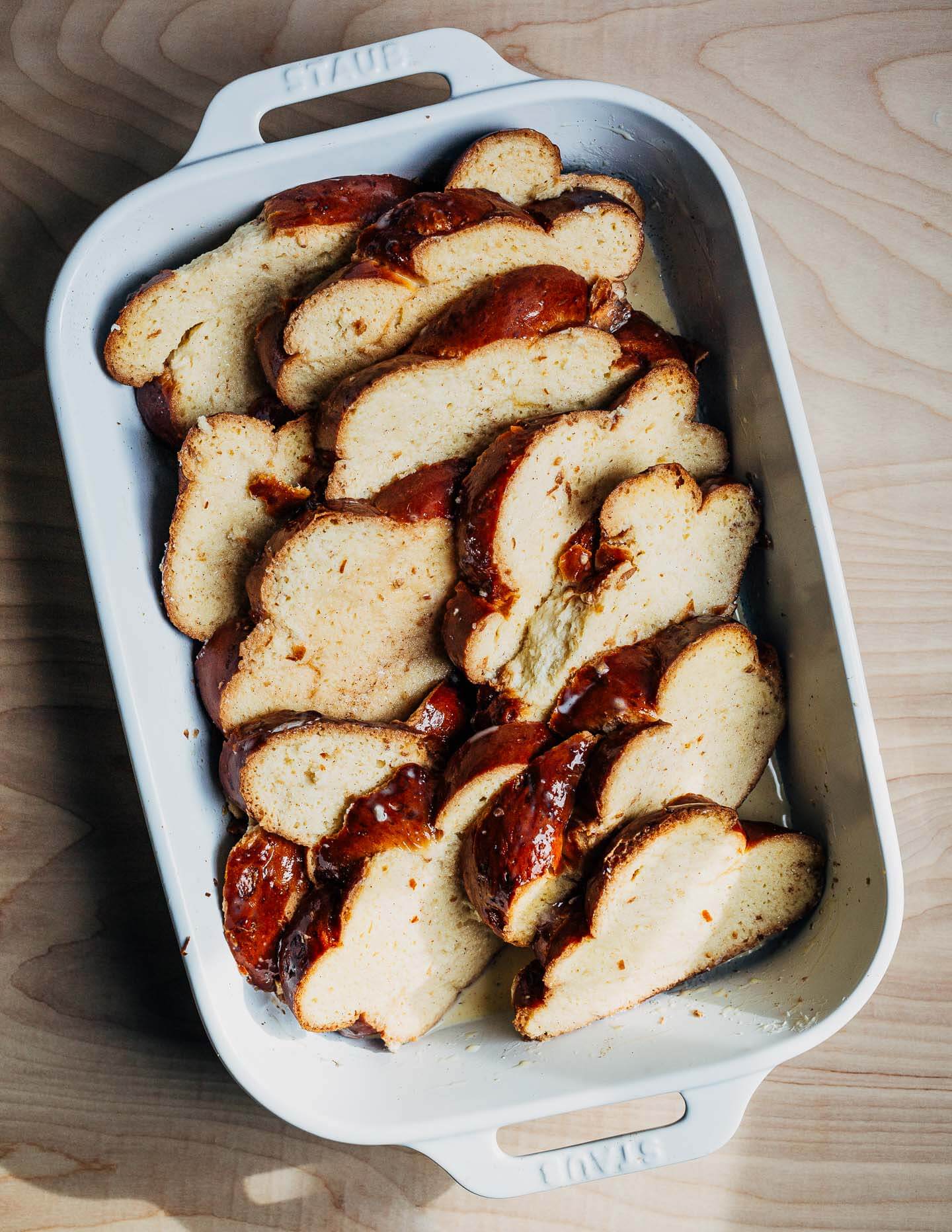 French toast in a baking dish, ready to be baked